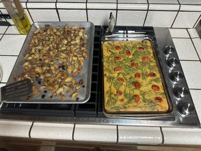 Potatoes and egg-ish casserole cooling on a stovetop